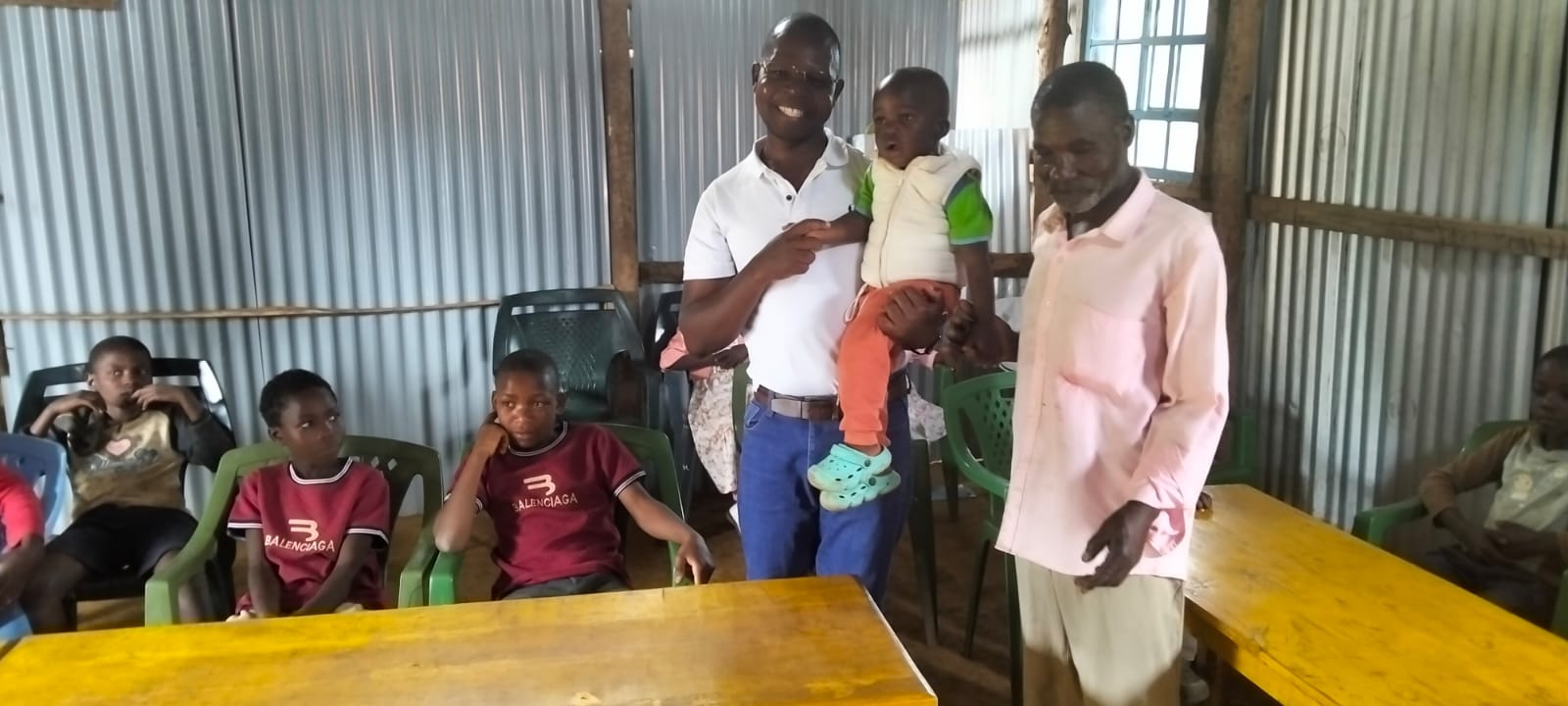 Children and community members during an activity of Reborn Foundation Kenya